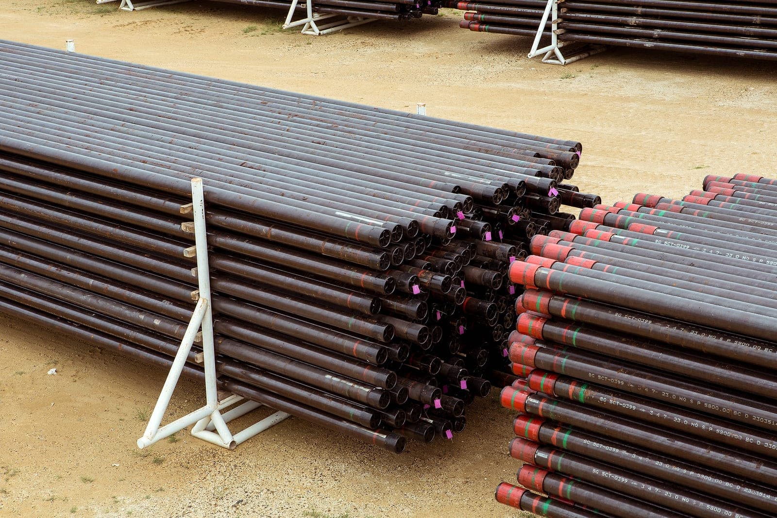Racked tubulars, coupling and pin ends.